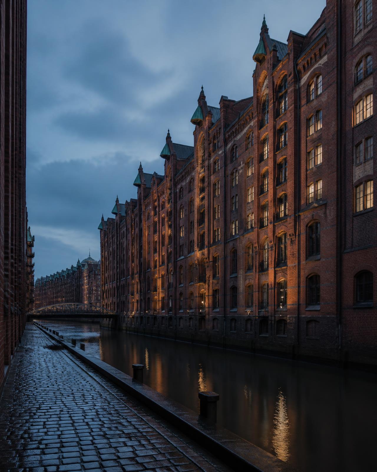 Hamburg's Speicherstadt warehouse district along the canal at dusk